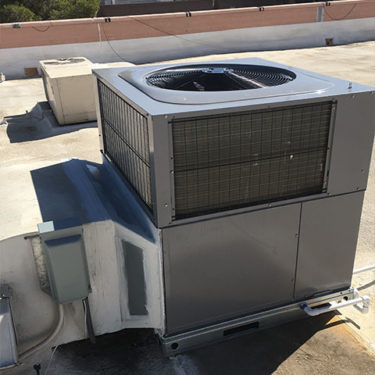 Installed a new package heat pump on a strip mall roof.