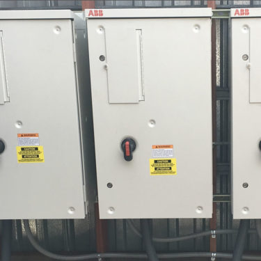 We installed three new variable frequency drives to control the speeds on a cooling tower fan and two system pumps.